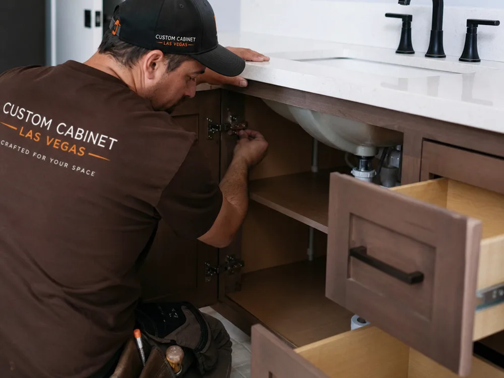 Bathroom vanity installation with full-extension drawers, soft-close hinges, tight door reveals, and sealed plumbing cutouts